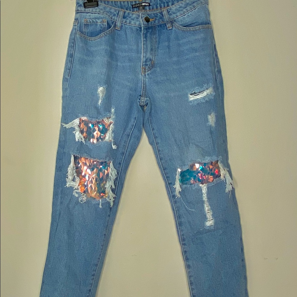 Fashion Nova ripped jeans with reflective dangles